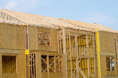 frame and rafters of a plywood house lumber roof wooden walls clipart