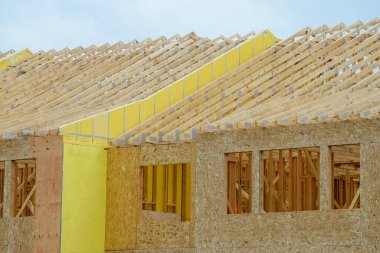 rafters and walls of a new plywood house property wood frame clipart