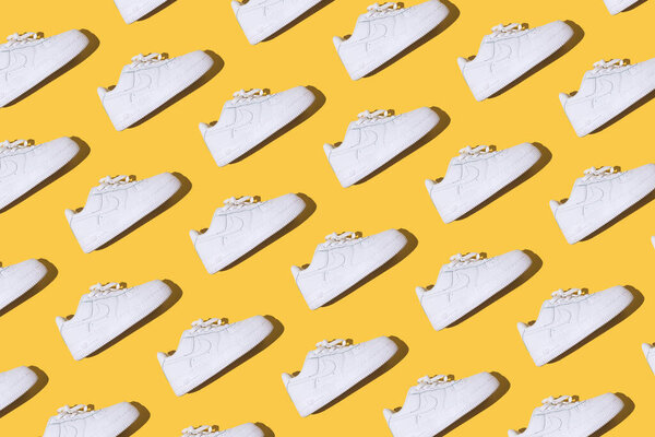 Nike Air Force 1 Pattern - Classic white retro basketball shoes with Nike Air technology consisting of pressurized air inside on a yellow background.