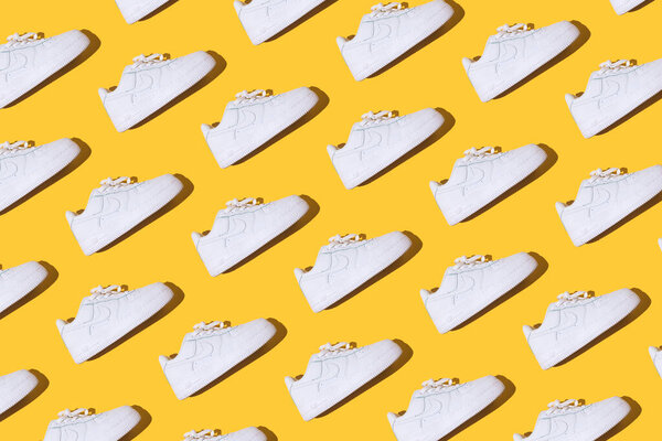 Nike Air Force 1 Pattern - Classic white retro basketball shoes with Nike Air technology consisting of pressurized air inside on a yellow background.