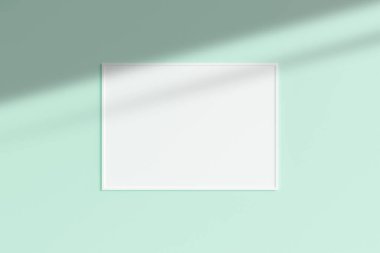 Gerçekçi beyaz yatay fotoğraf çerçevesi. Gölgeli boş duvar odasında asılı duruyor. 3d oluşturma.