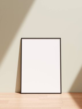 Oturma odasındaki ahşap zeminde duran gölgeli poster çerçevesi..