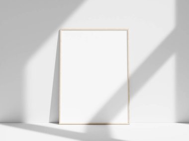 Pencere gölgesi olan beyaz duvara boş çerçeve