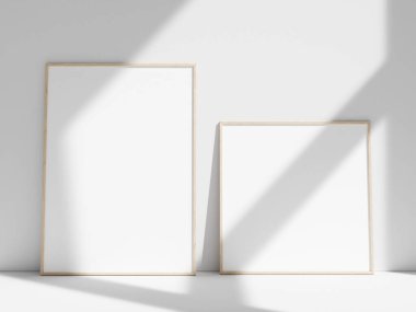 Pencere gölgesi olan beyaz duvara boş çerçeve