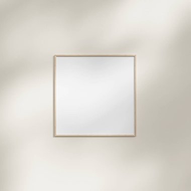 Yaprak gölgesi olan beyaz bir duvarda asılı çerçeve