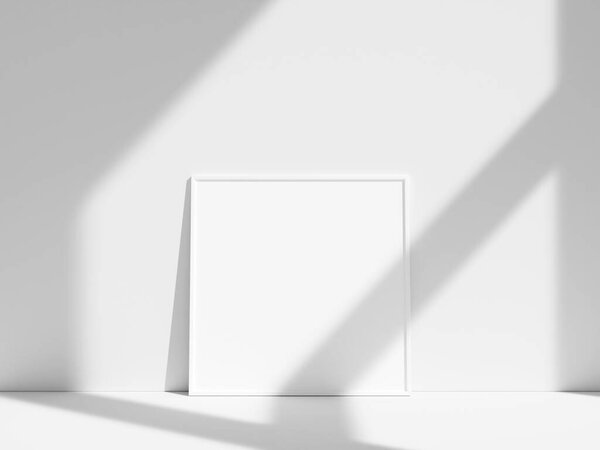 Empty frame on the white wall with window shadow