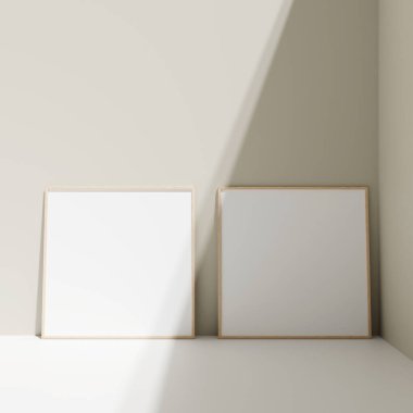 Poster fotoğraf çerçevesi gölgeli zemindeki pastel duvara yaslanmış.