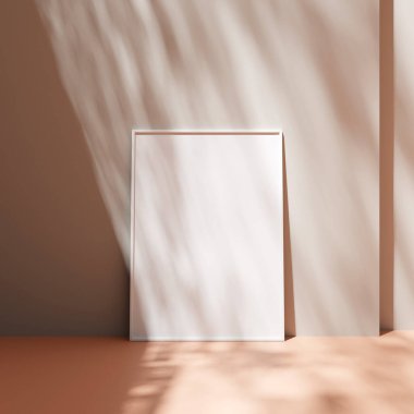 Poster çerçevesi, yerdeki pastel duvara yaslanmış, gölgeli.