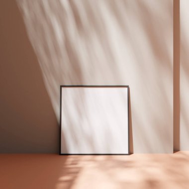 Poster çerçevesi, yerdeki pastel duvara yaslanmış, gölgeli.