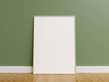 Çerçeve maketi. Ahşap zeminde yeşil duvarlı çerçeve posteri.