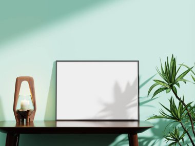 Çağdaş siyah çerçeve nane yeşili bir duvarda, ahşap bir mum tutacağı ve modern sanat sergileri için ideal dekoratif bir bitki barındırıyor..