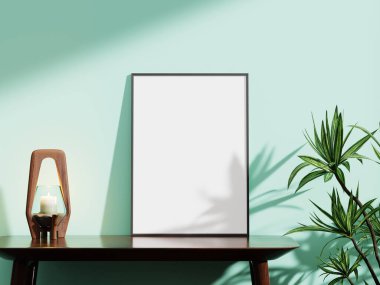 Modern beyaz çerçeve, nane yeşili bir duvara karşı, ahşap bir mum tutacağı ve yapraklı bir bitki içeriyor, sanat eserleri veya fotoğrafçılık için mükemmel..