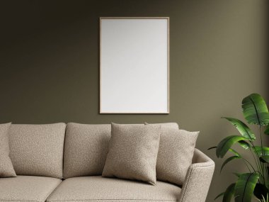 Koyu yeşil bir duvarda modern ahşap çerçeve modeli, rahat bir kanepe ve dekoratif yastıkla tamamlanmış, manzarasında canlı bir bitki var..