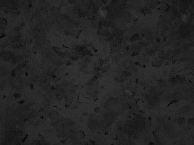 Düzensiz lekeleri olan koyu beton arkaplan ve hafif solgunluk.