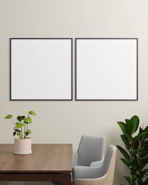 Tarafsız bir duvarda, masa ve bitkilerle yan yana duran iki siyah fotoğraf çerçevesi, yaratıcı çalışmaları sergilemek için modern ve dengeli bir alan sağlıyor..
