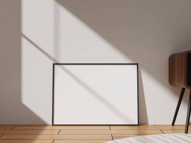 A bold black square photo frame in a sunlit room, creating an inviting atmosphere, great for promoting artistic displays or interior design ideas.