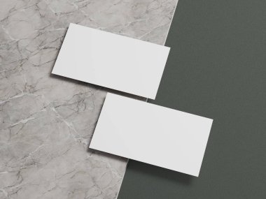 Clean business card mockup with two white cards aligned on a contrasting marble and green backdrop.