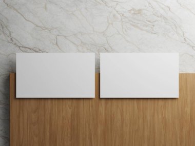 Ahşap ve mermer bir zemine simetrik olarak yerleştirilmiş iki beyaz kartvizit..