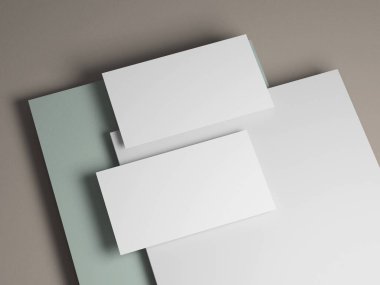 Temiz iş kartı modeli, yumuşak gri, beyaz ve pastel yeşil arka plan katmanları var..