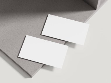 İnce gölgeli, lüks markalaşma için mükemmel bej çimento bloğa yerleştirilmiş sofistike bir kartvizit modeli..