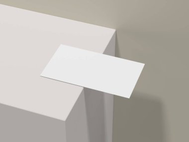 Minimalist kartvizit modeli açık bej masanın kenarında.
