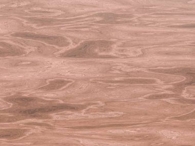 Kahverengi mermer ahşap desenli eşsiz girdap desenleri ve işaretleri var..