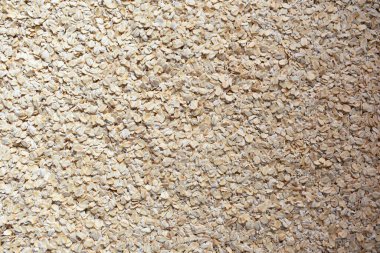 Raw whole dried rolled oats clipart