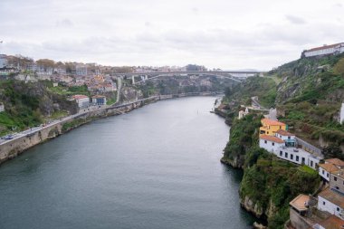 View of Douro river from Dom Luis I Bridge in a cloudy day