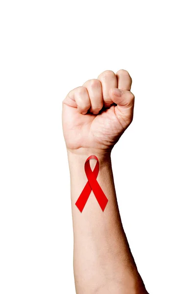 stock image Vertical shot of the World's Aids Day Ribbon painted on human raised fist