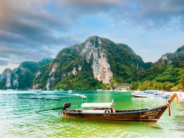 20 Dec 2020 last year , Long tail boat anchored at Phi Phi Island Krabi Province, Thailand with tourists, tourist attractions, viewpoints, beautiful sea. Mobile phone photo