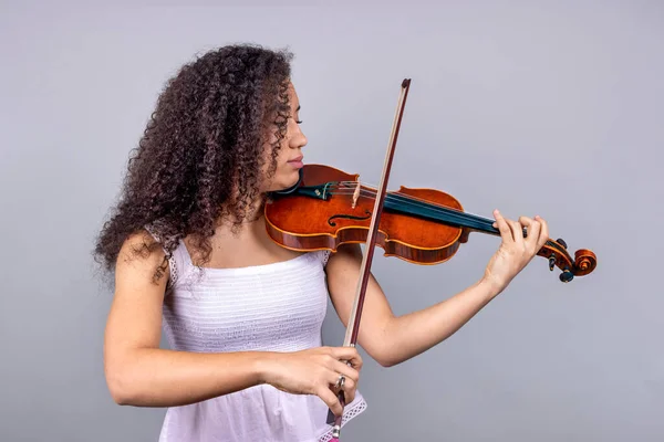 African american professional violinist woman playing violin
