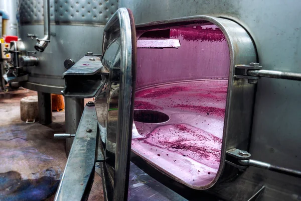 Wine fermentation tank. Remains of wine fermentation inside the tank.