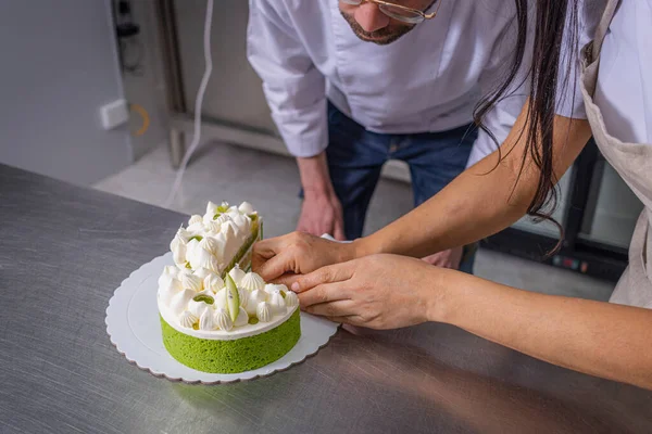 stock image Close-up of pastry chefs working on a key lime tart.