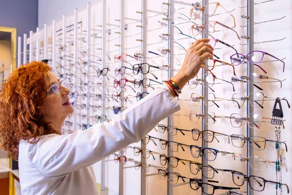 Red Haired Medical Optician Choosing Glasses Optician Shop — Stock Photo, Image