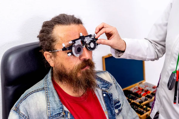Viking man with measuring glasses to check vision