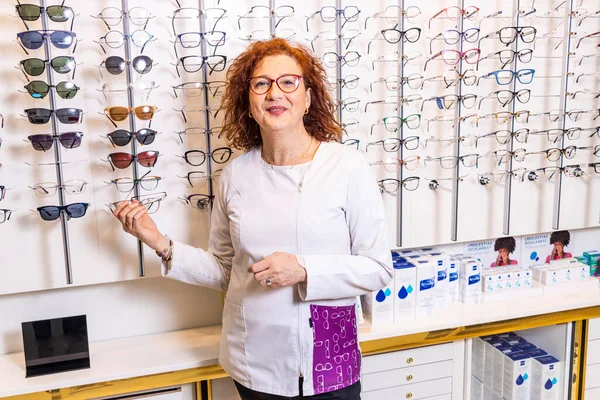 Modern Optometry Red Haired Optometrist Choosing Eyeglasses Wall Sized Display — Stock Photo, Image