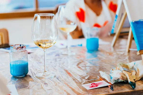 Creative Wine Painting: Women Expressing with Brushes and Wine