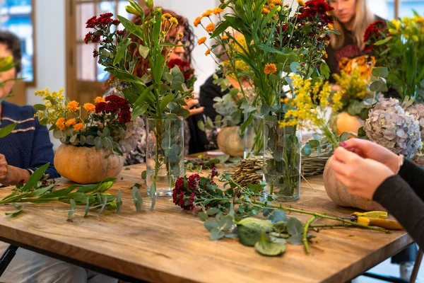 Natural flowers. Floral arrangement workshop with autumn flowers.