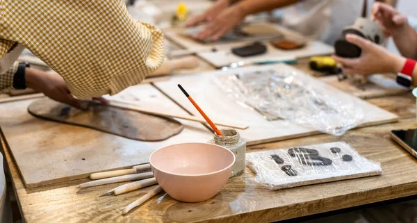 Ceramic works. Workshop table where women work clay.