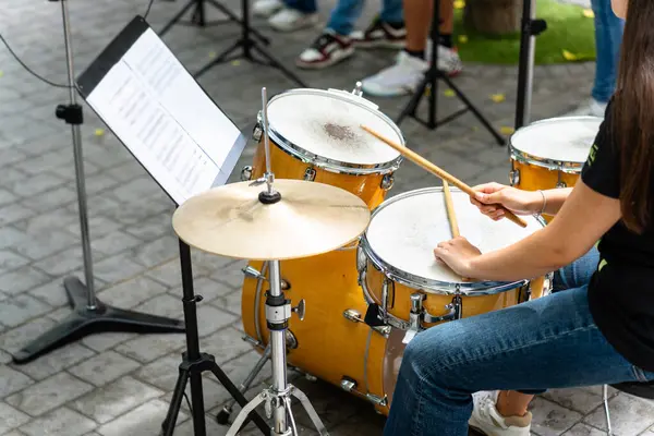 stock image Female musician percussionist playing drums