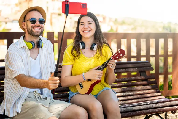 stock image Happy tourists capturing their journey with a selfie