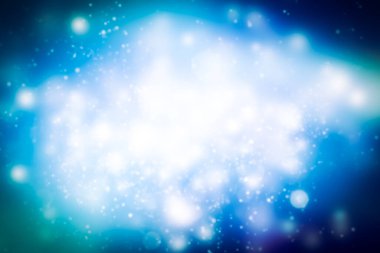 Mavi arka planda beyaz pullu parlak bulanıklık. Kar Bokeh Noel 'i Güzel parlak Noel ışıklarını bulanıklaştırdı.