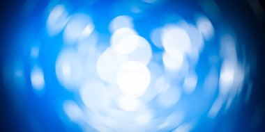Beyaz bokeh bulanık arkaplan. Mavi arka planda daire ışığı. soyut ışık arkaplanı