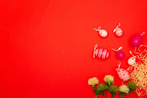 stock image With this red background that features Easter eggs and flowers, you'll have plenty of space to tape your Easter message