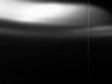 Stainless steel large sheet  With light hitting the surface  For background,Inside passenger elevator,Reflection of light on a shiny metal texture,stainless steel background.