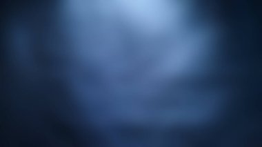 blue blurred background with light gradient pattern.