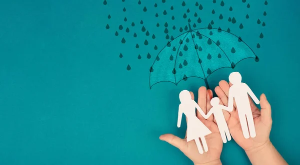 Umbrella protects family from difficult problems, help and support, social issue, insurance business