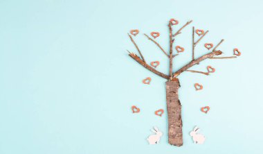 Tree with hearts and bunny or easter rabbit, love and emotion, spring holiday valentine card