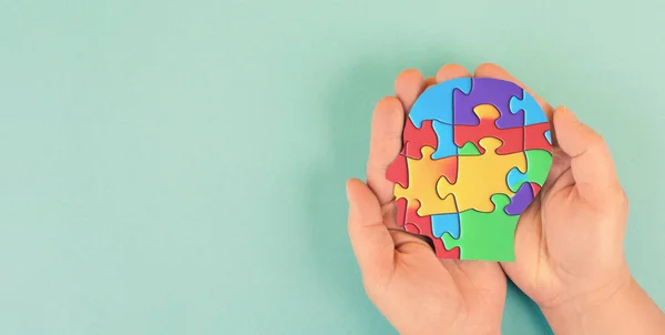 ASD autism spectrum disorder, deficits in social communication and interaction, mind with colorful jigsaw or puzzle pieces