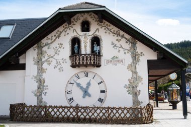 Cuckoo clocks at the Drubba store in the Black Forest, Lake Titisee Neustadt in Germany, traditional craft, vintage wood carving, 30.03.2024 clipart